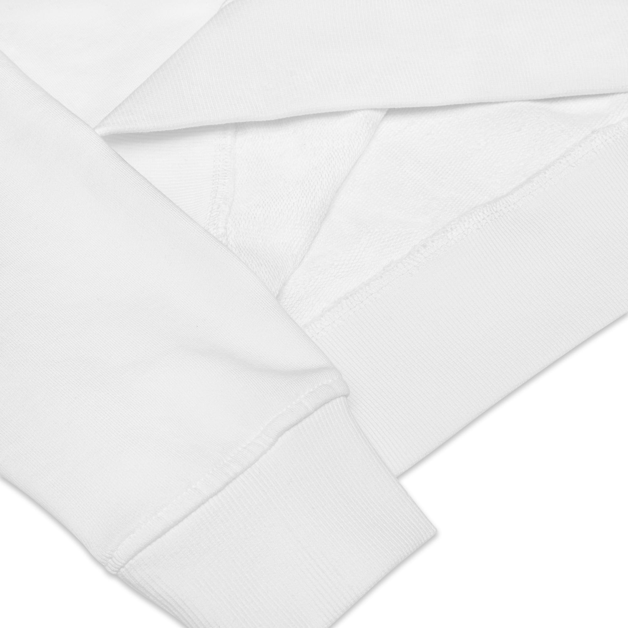 Gros plan texturé sur le bord-côte élastique d'une manche et du bas d'un sweat alpha en molleton de coton blanc premium. Focus sur les finitions de haute qualité Mister Felpatee.